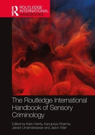 A photograph of the cover of the 'Routledge International Handbook of Sensory Criminology', co-edited by Kate Heritty, Kanupriyal Sharma, Janani Umamaheswar, and Jason Warr. 
